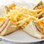 club-sandwich-or-ham-and-egg-sandwich-with-french-fries-T5TN0B